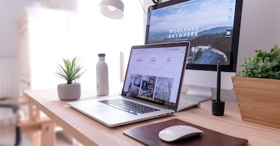 MacBook Pro beside White iMac and Magic Mouse